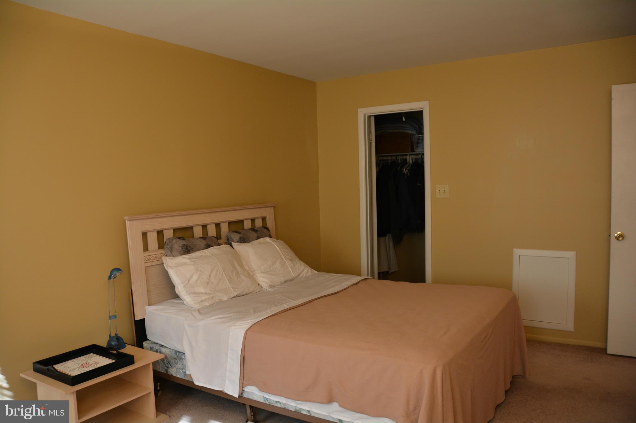 7004 Basswood Road Frederick, MD 21703 - Photo 11 of 16 a bedroom with a bed and a window