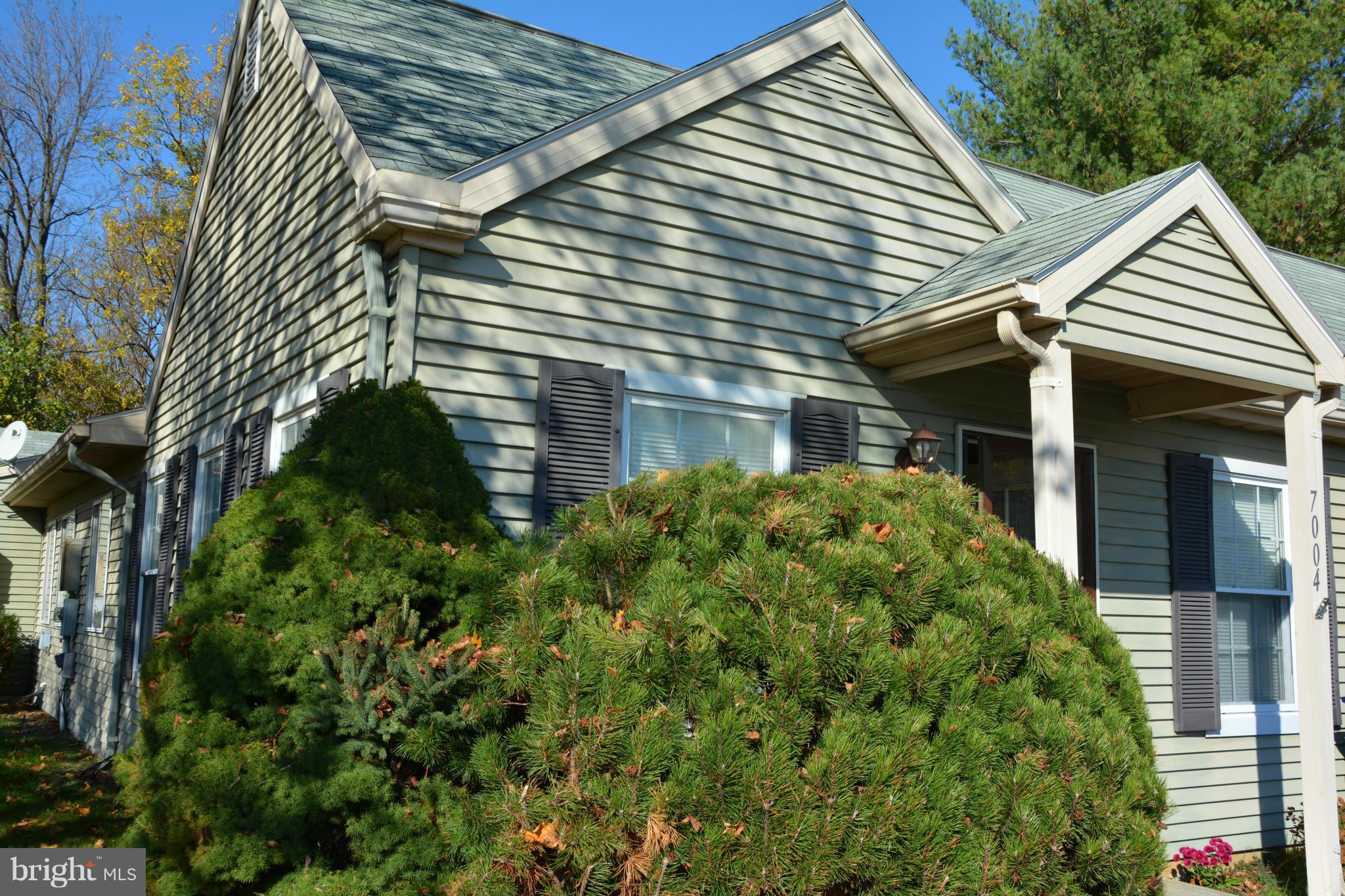 7004 Basswood Road Frederick, MD 21703 - Photo 16 of 16 a front view of a house with a garden