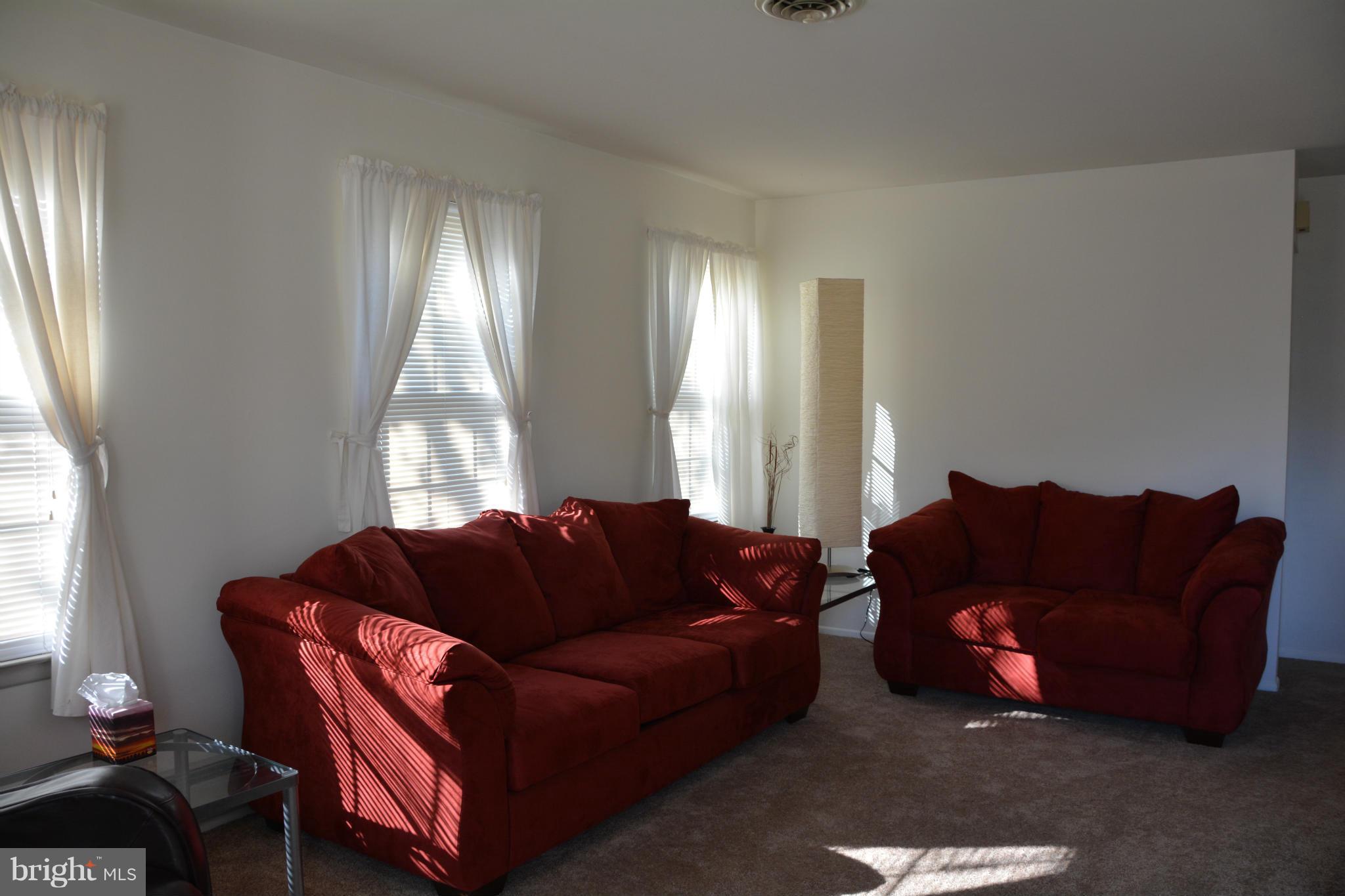 7004 Basswood Road Frederick, MD 21703 - Photo 5 of 16 a living room with furniture and a window