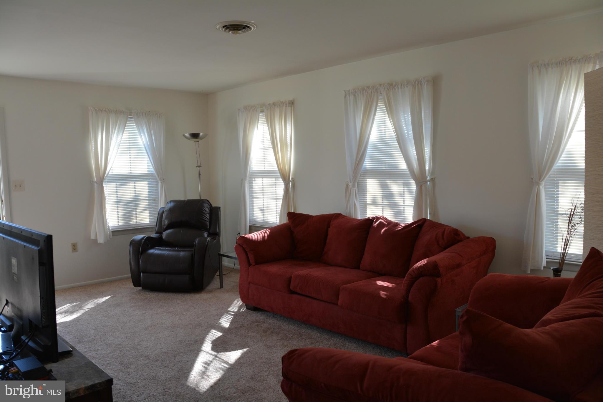 7004 Basswood Road Frederick, MD 21703 - Photo 6 of 16 a living room with furniture and a window