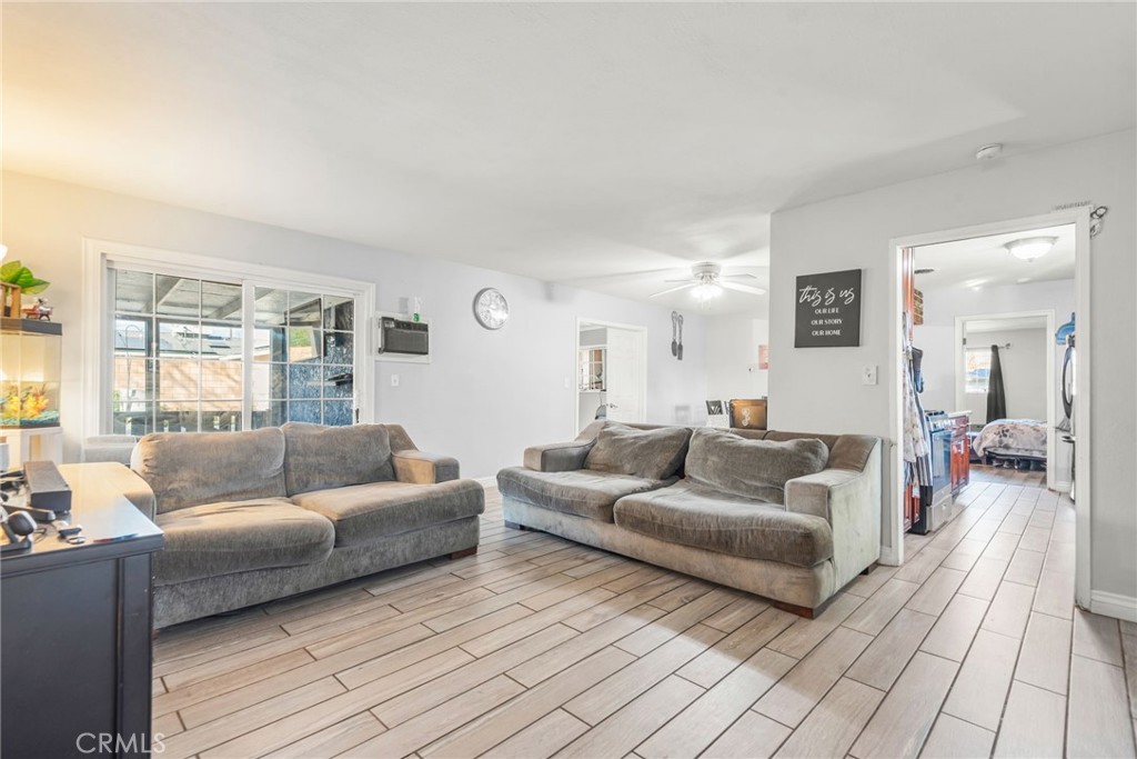 19450 Woodhill Street Rialto, CA 92376 - Photo 18 of 51 a living room with furniture and a couch