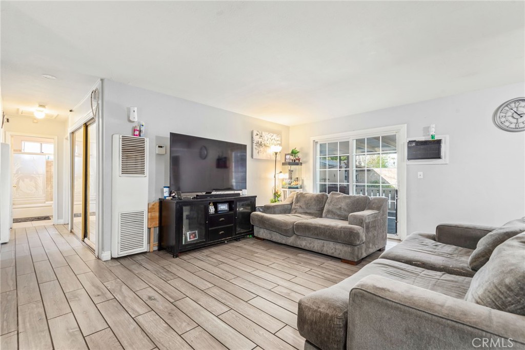 19450 Woodhill Street Rialto, CA 92376 - Photo 19 of 51 a living room with furniture and a flat screen tv