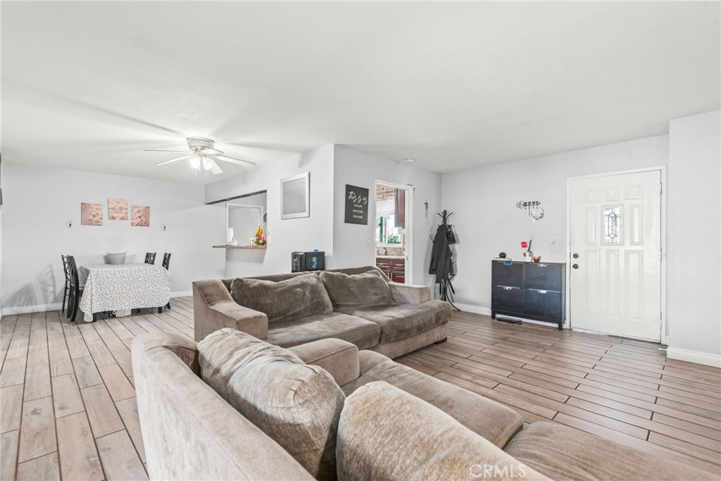 19450 Woodhill Street Rialto, CA 92376 - Photo 21 of 51 a living room with furniture and a couch