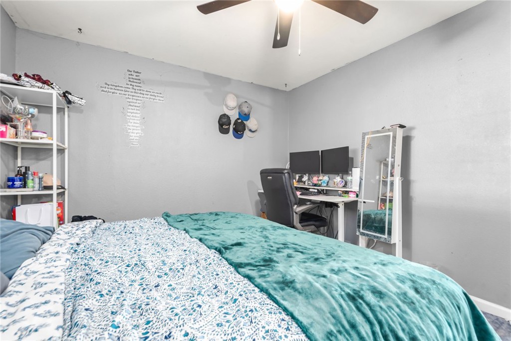 19450 Woodhill Street Rialto, CA 92376 - Photo 25 of 51 a bedroom with a bed and a television