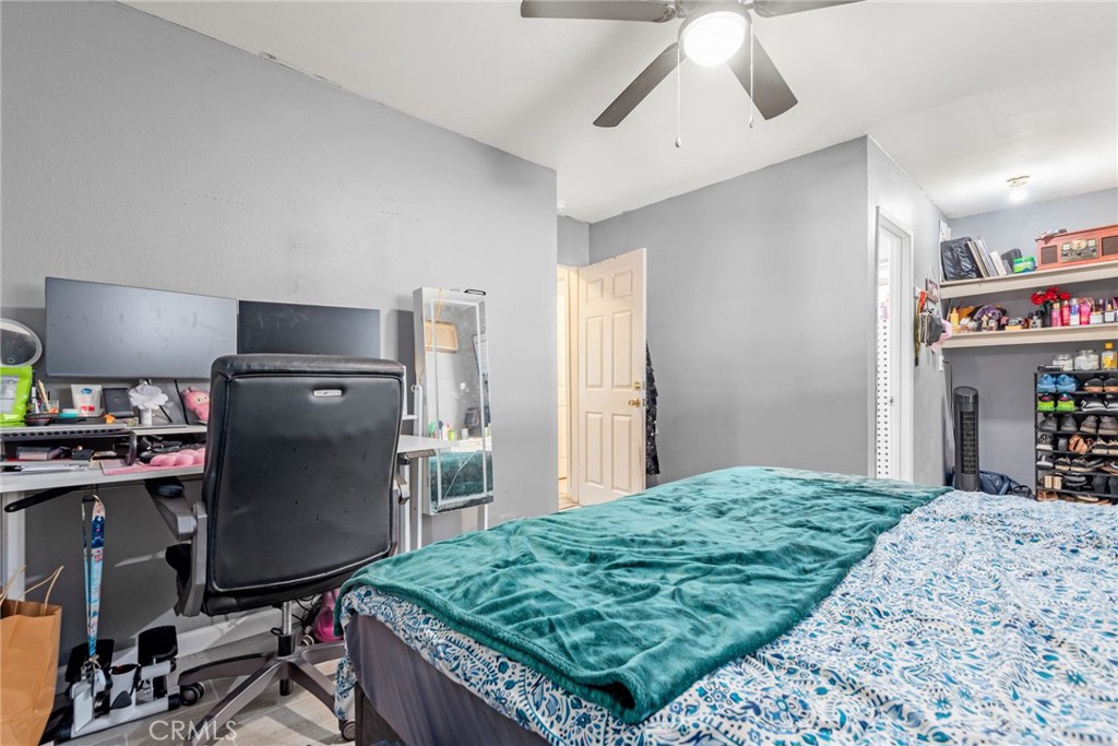 19450 Woodhill Street Rialto, CA 92376 - Photo 26 of 51 a bedroom with a bed and a desk