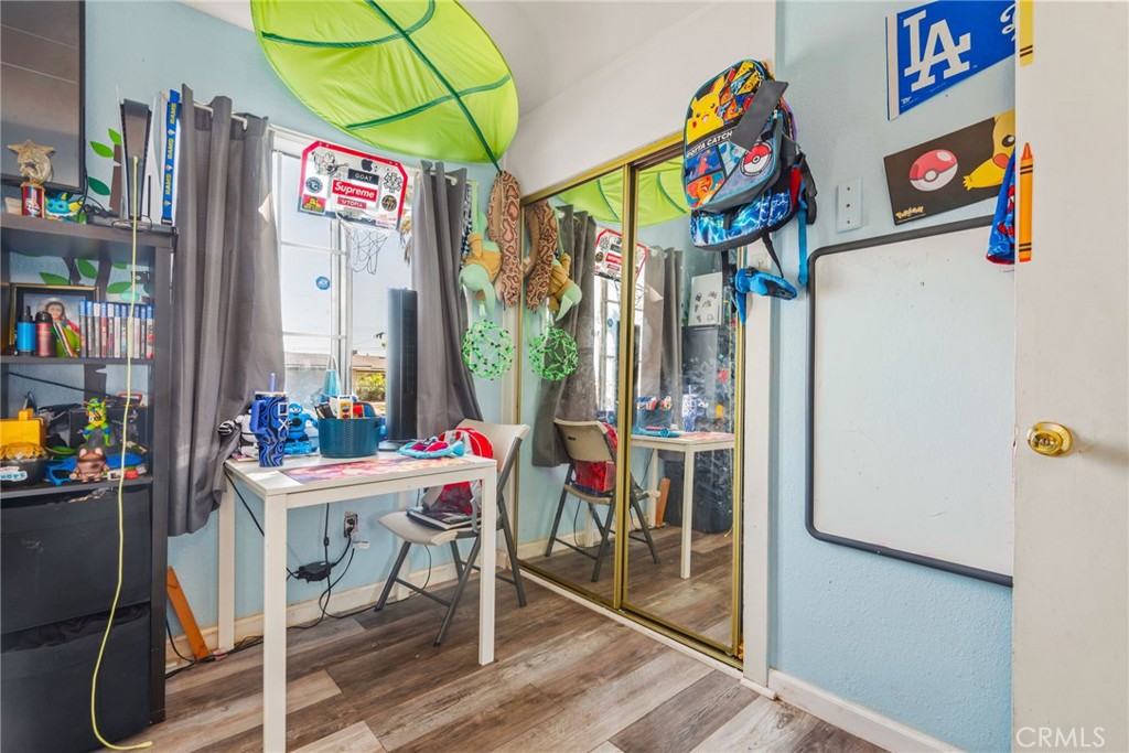 19450 Woodhill Street Rialto, CA 92376 - Photo 33 of 51 a group of people sitting outside of a building