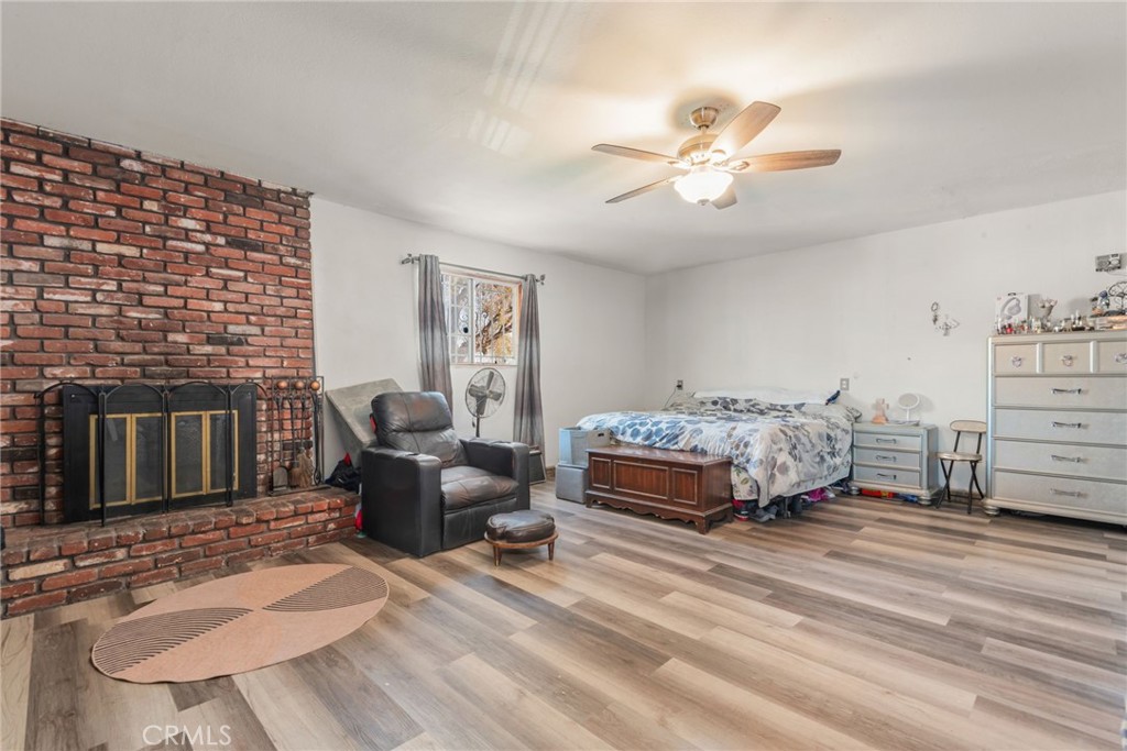 19450 Woodhill Street Rialto, CA 92376 - Photo 35 of 51 a bedroom with a bed and a couch