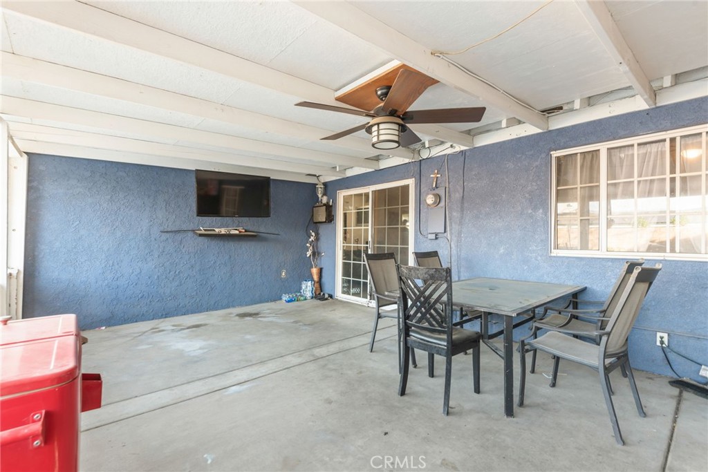 19450 Woodhill Street Rialto, CA 92376 - Photo 41 of 51 a view of a livingroom with furniture and a flat screen tv