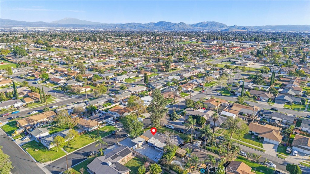 19450 Woodhill Street Rialto, CA 92376 - Photo 50 of 51 an aerial view of residential houses with outdoor space and trees