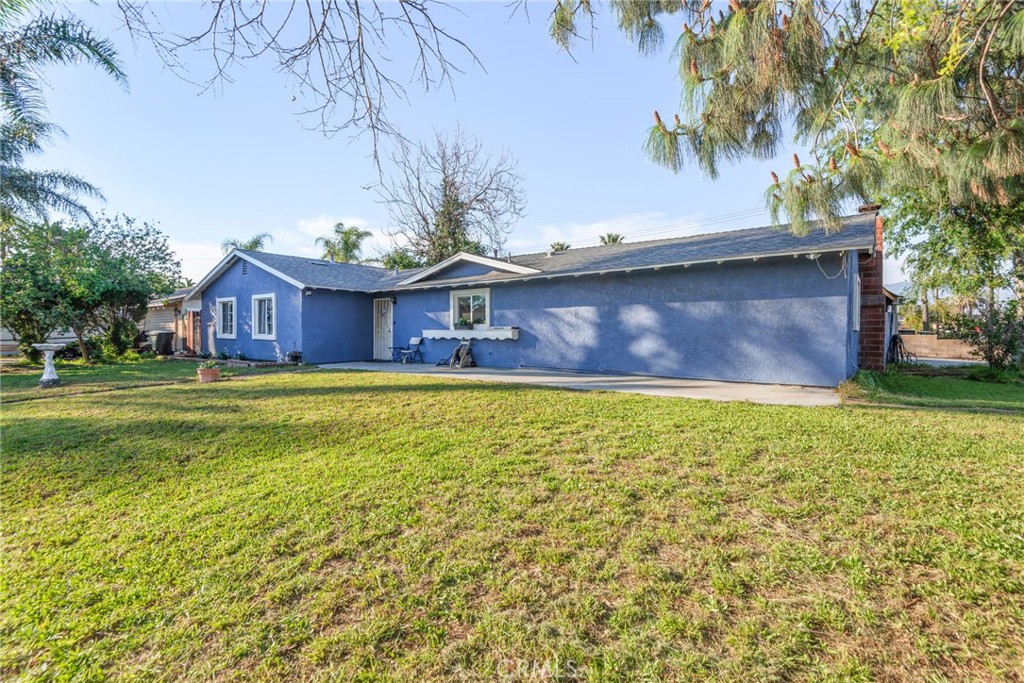 19450 Woodhill Street Rialto, CA 92376 - Photo 5 of 51 a view of house with a yard