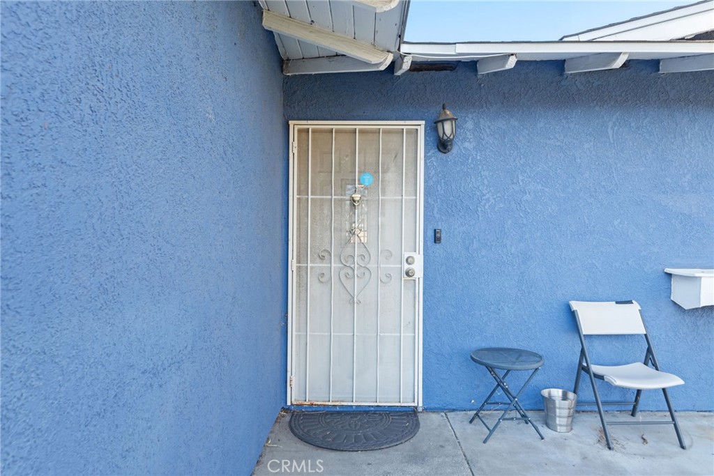 19450 Woodhill Street Rialto, CA 92376 - Photo 9 of 51 a bathroom with a toilet and a chair