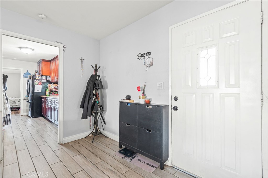 19450 Woodhill Street Rialto, CA 92376 - Photo 10 of 51 a view of a hallway with closet and workspace