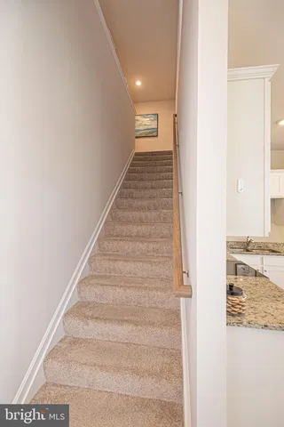 a bedroom with a bed and hallway