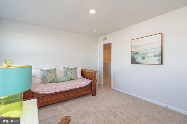an aerial view of a house with a swimming pool patio and outdoor seating