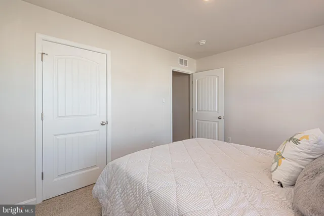 an aerial view of a house with outdoor space pool tennis courts and ocean view