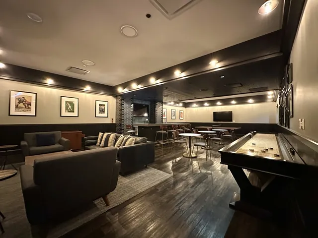 a view of a roof deck with couches and sky view