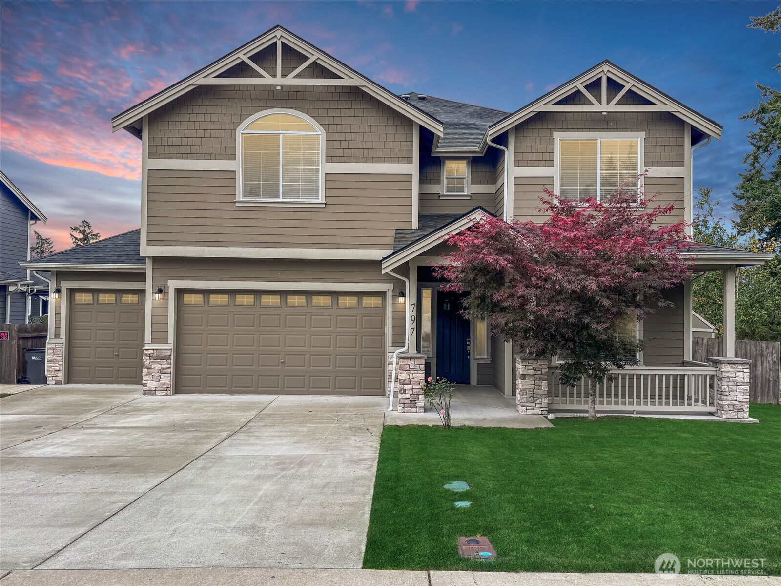 a front view of a house with a yard