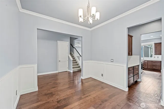 a view of an empty room with a fireplace and a window