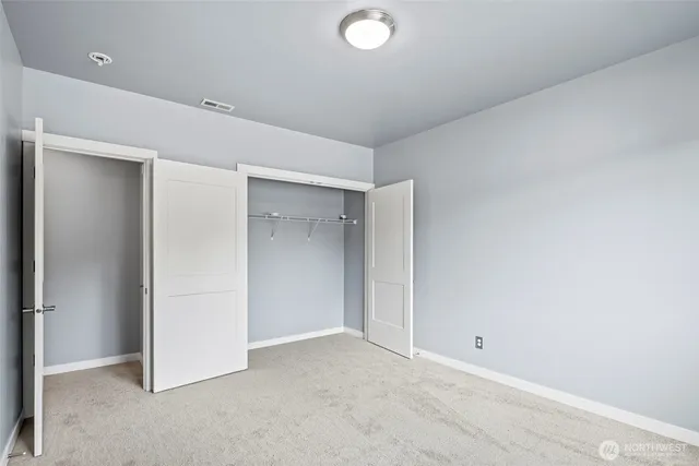 a bathroom with a sink double vanity and a mirror