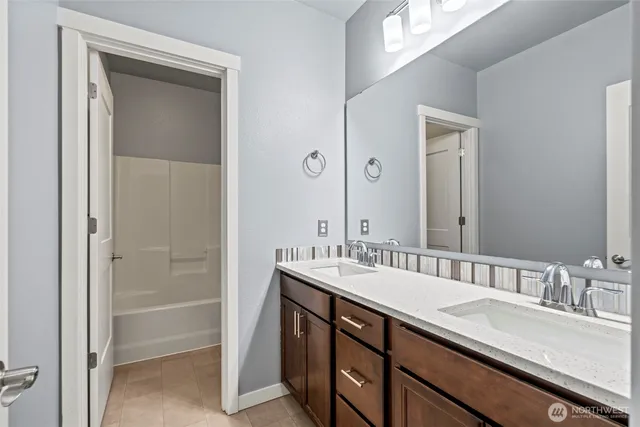 a view of a porch with wooden floor and wooden fence