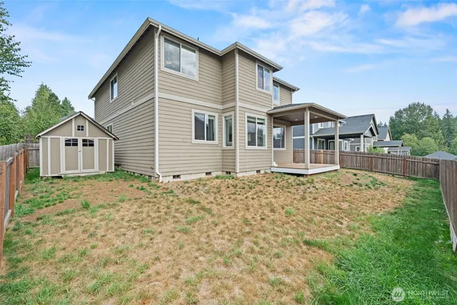 front view of a house with a door and a potted plant
