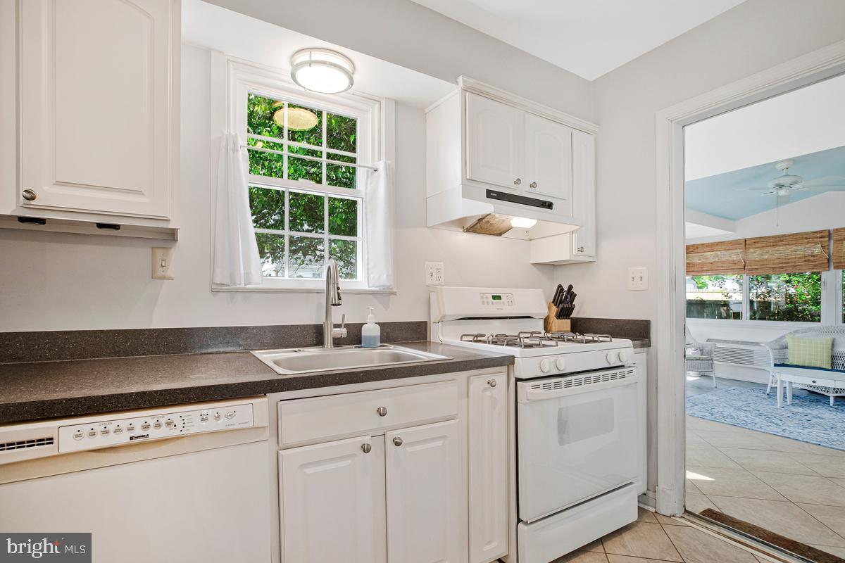 601 Forest View Road Linthicum Heights, MD 21090 - Photo 13 of 37 a kitchen with white cabinets and white appliances
