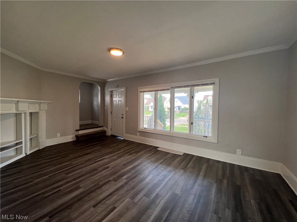 14807 Alger Road Cleveland, OH 44111 - Photo 2 of 16 Hardwood floored living room with crown molding