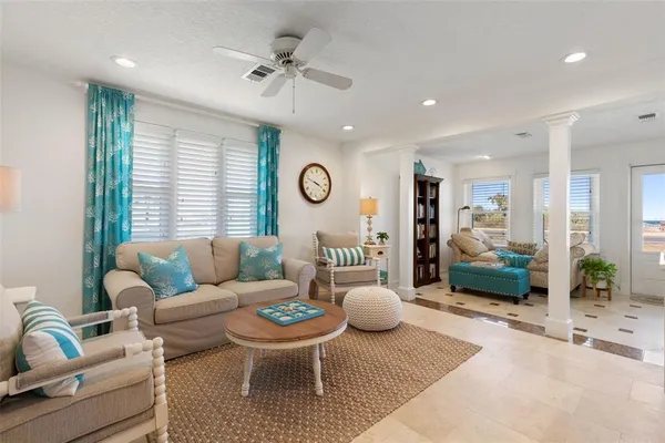 a dining room with furniture a rug and wooden floor