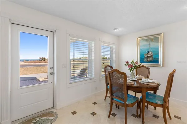 a dining room with furniture and window