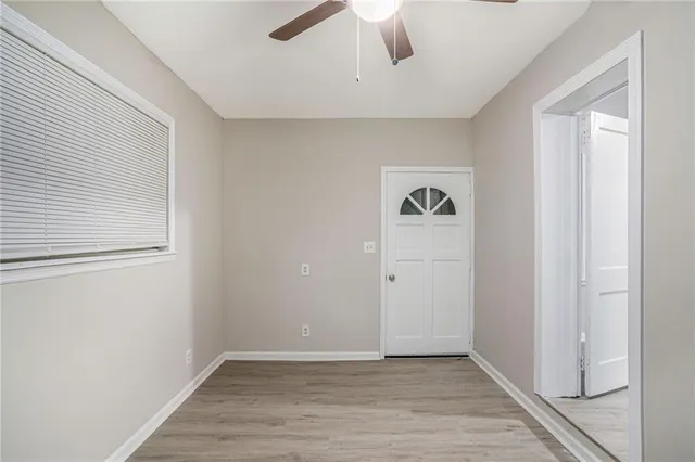 a view of an empty room with a window