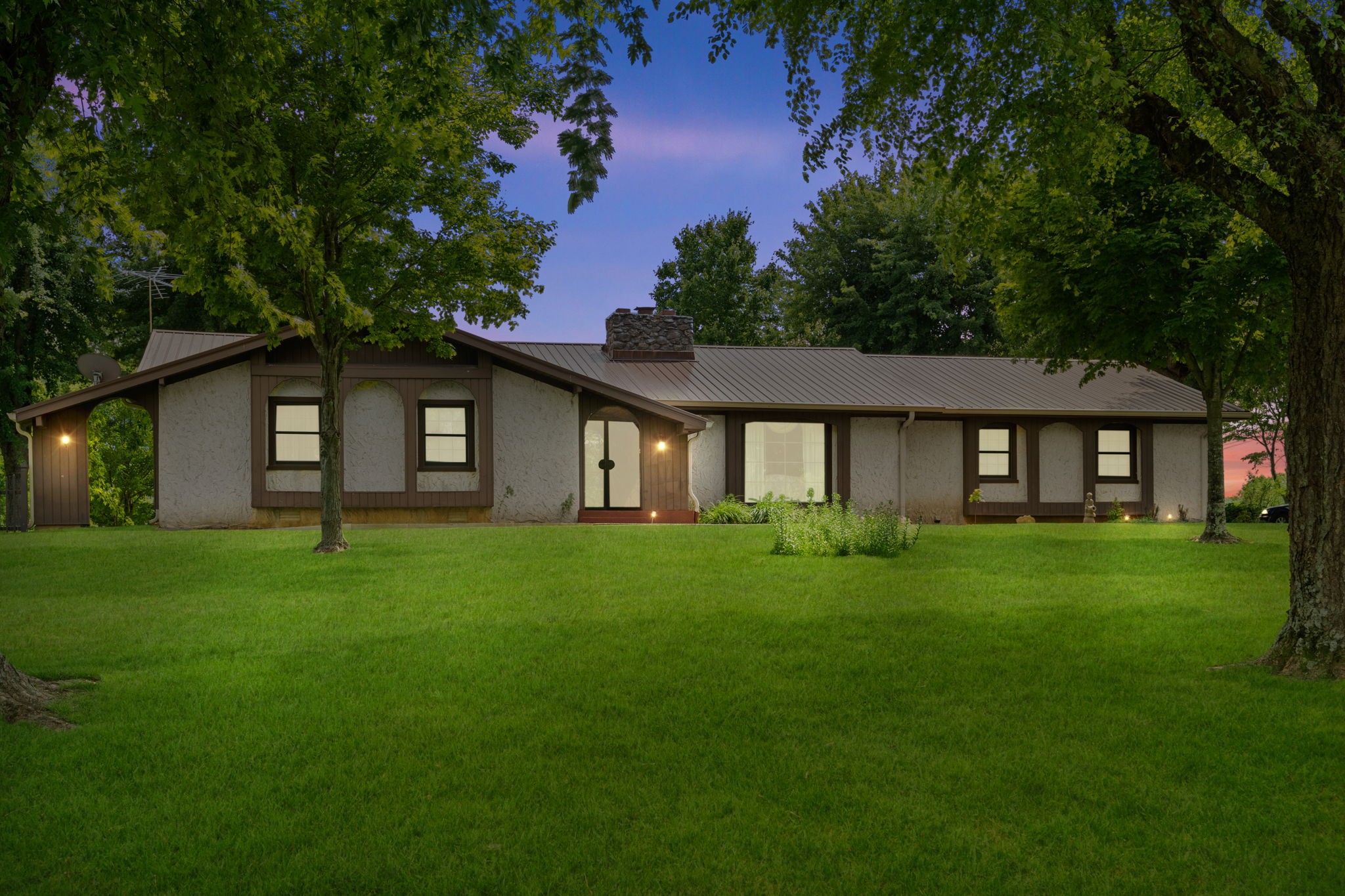141 Jernigan Road Portland, TN 37148 - Photo 1 of 24 a view of a house with a big yard and garden