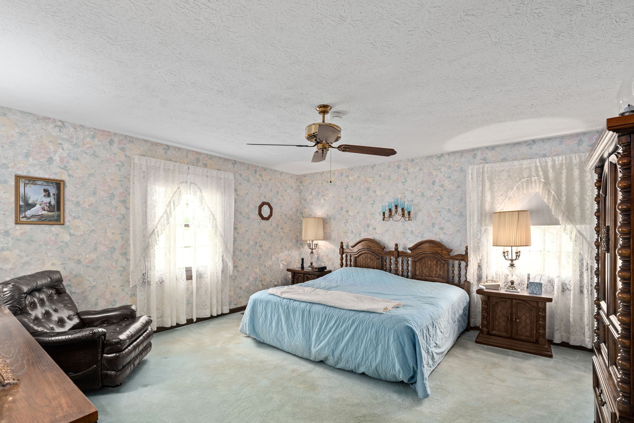 141 Jernigan Road Portland, TN 37148 - Photo 20 of 24 a bedroom with a bed and a chandelier