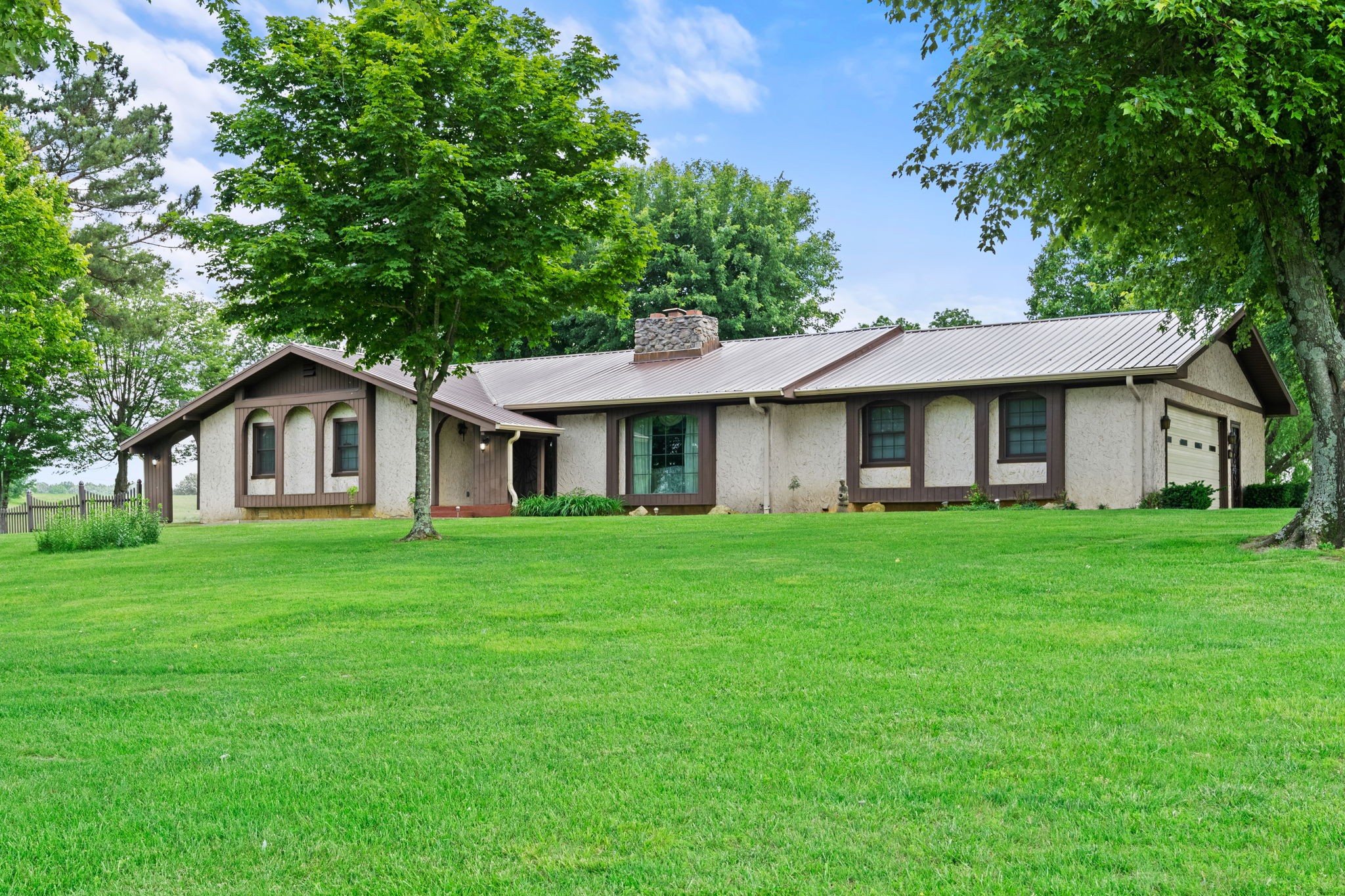 141 Jernigan Road Portland, TN 37148 - Photo 2 of 24 a front view of a house with a garden