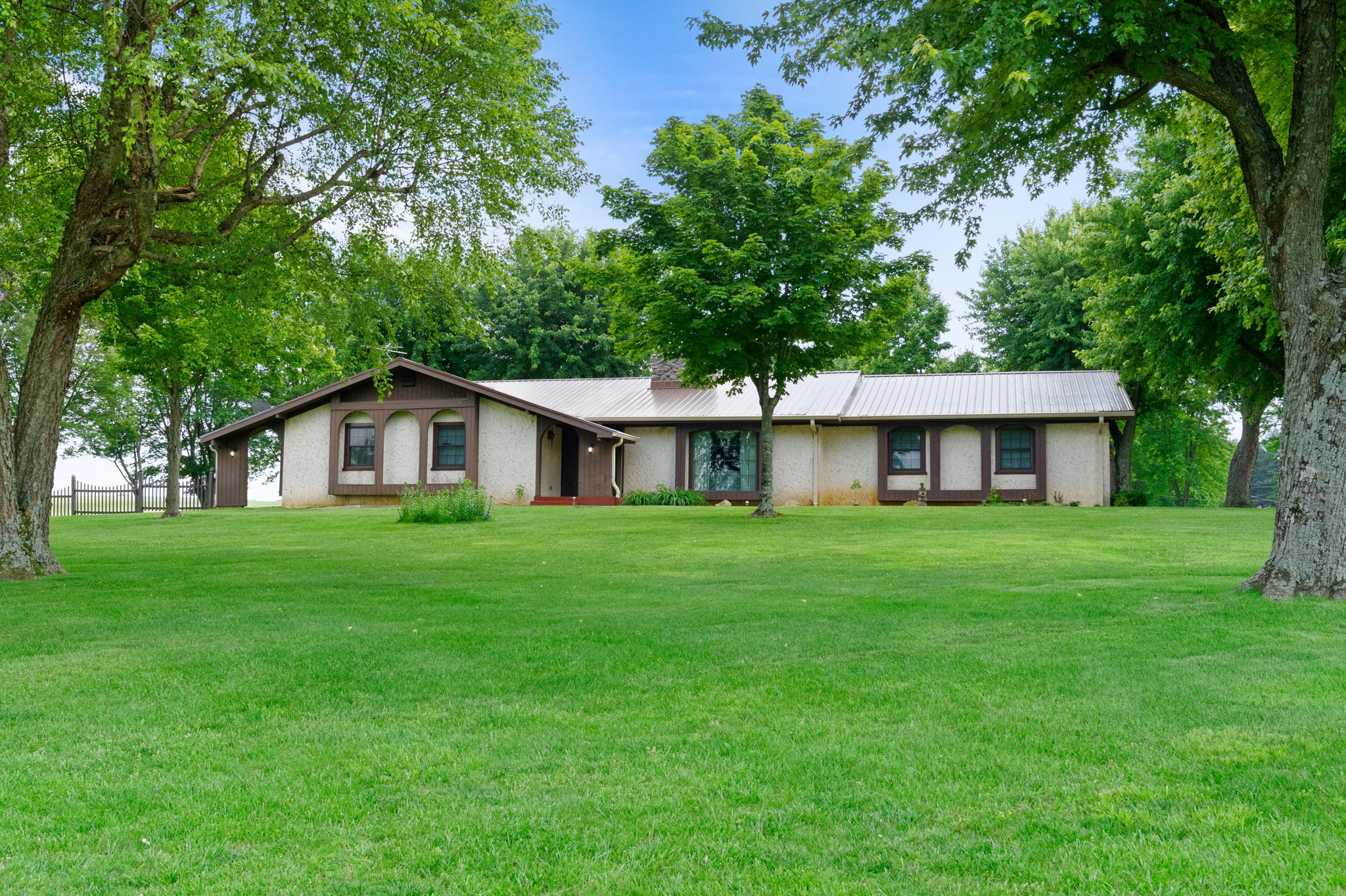 141 Jernigan Road Portland, TN 37148 - Photo 3 of 24 a front view of a house with a yard and trees