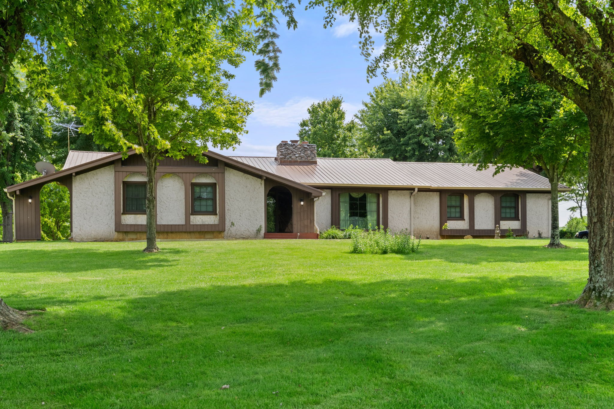 141 Jernigan Road Portland, TN 37148 - Photo 4 of 24 a front view of a house with a garden