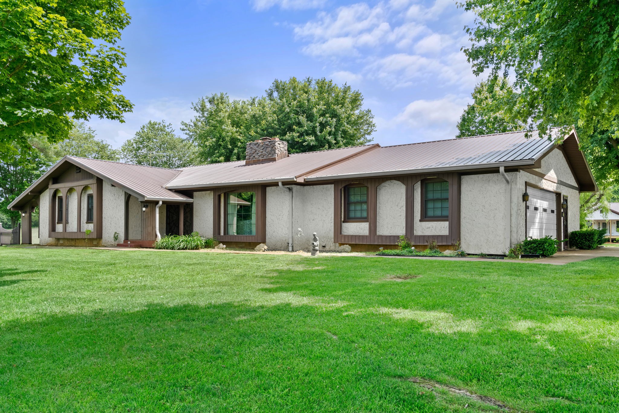 141 Jernigan Road Portland, TN 37148 - Photo 5 of 24 a front view of a house with a garden