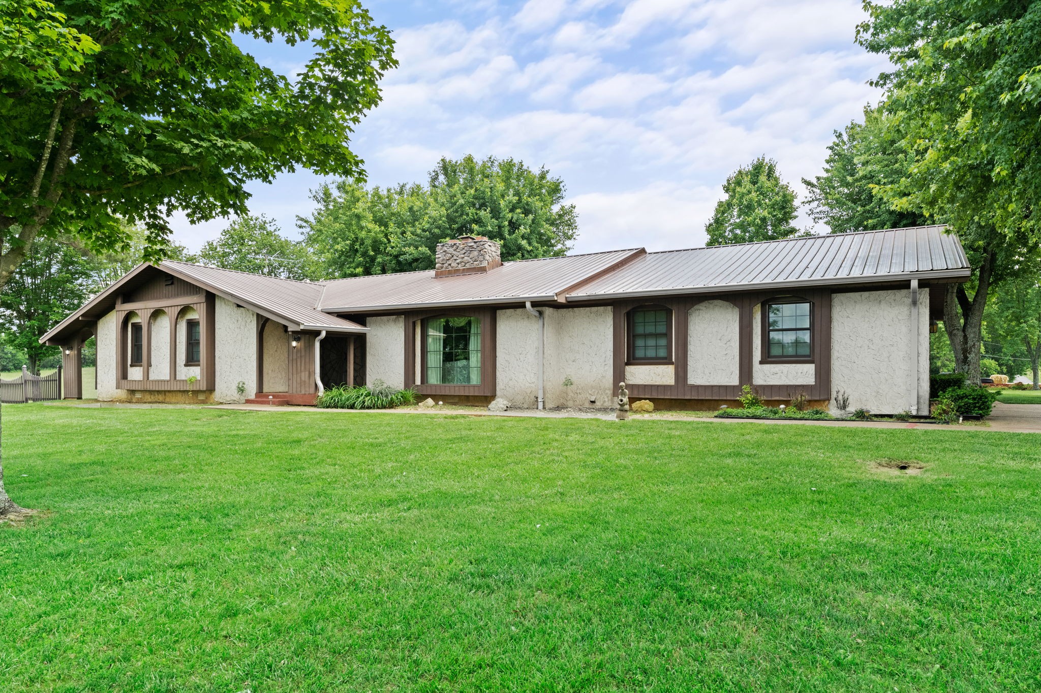 141 Jernigan Road Portland, TN 37148 - Photo 6 of 24 a front view of a house with a garden