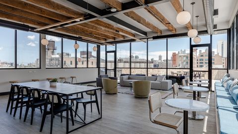 729 North Sangamon Street, Unit 303 Chicago, IL 60642 - Photo 12 of 16 a view of a dining room with furniture large windows and wooden floor