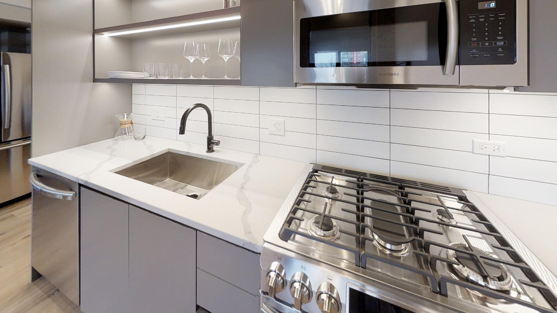 729 North Sangamon Street, Unit 303 Chicago, IL 60642 - Photo 2 of 16 a close view of sink and tap