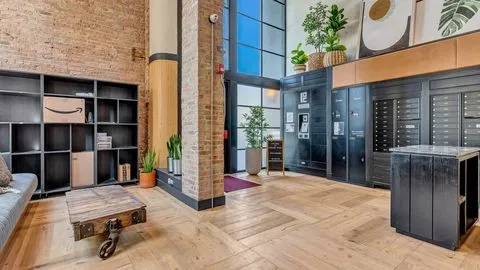 a view of a balcony with furniture and floor to ceiling window