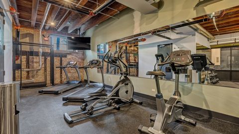 729 North Sangamon Street, Unit 303 Chicago, IL 60642 - Photo 10 of 16 a view of a room with gym equipment