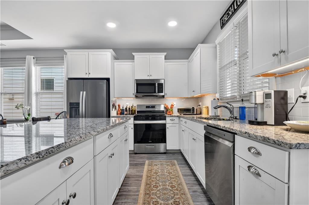 24 Teton Trail Jasper, GA 30143 - Photo 13 of 41 a kitchen with granite countertop stainless steel appliances and white cabinets