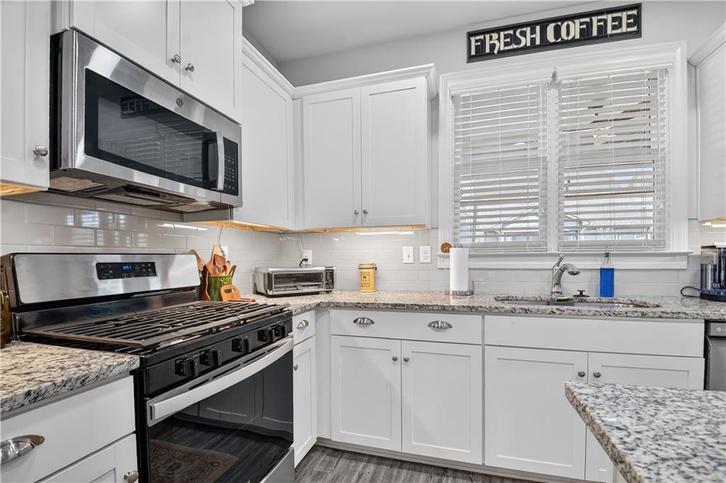 24 Teton Trail Jasper, GA 30143 - Photo 15 of 41 a kitchen with stainless steel appliances granite countertop a stove a sink and a microwave