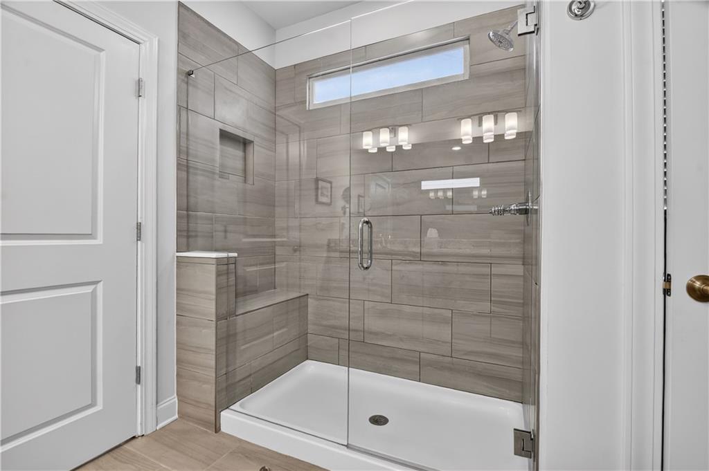 24 Teton Trail Jasper, GA 30143 - Photo 23 of 41 a bathroom with a glass shower door