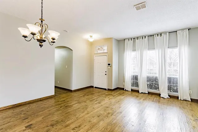 a view of a livingroom with wooden floor
