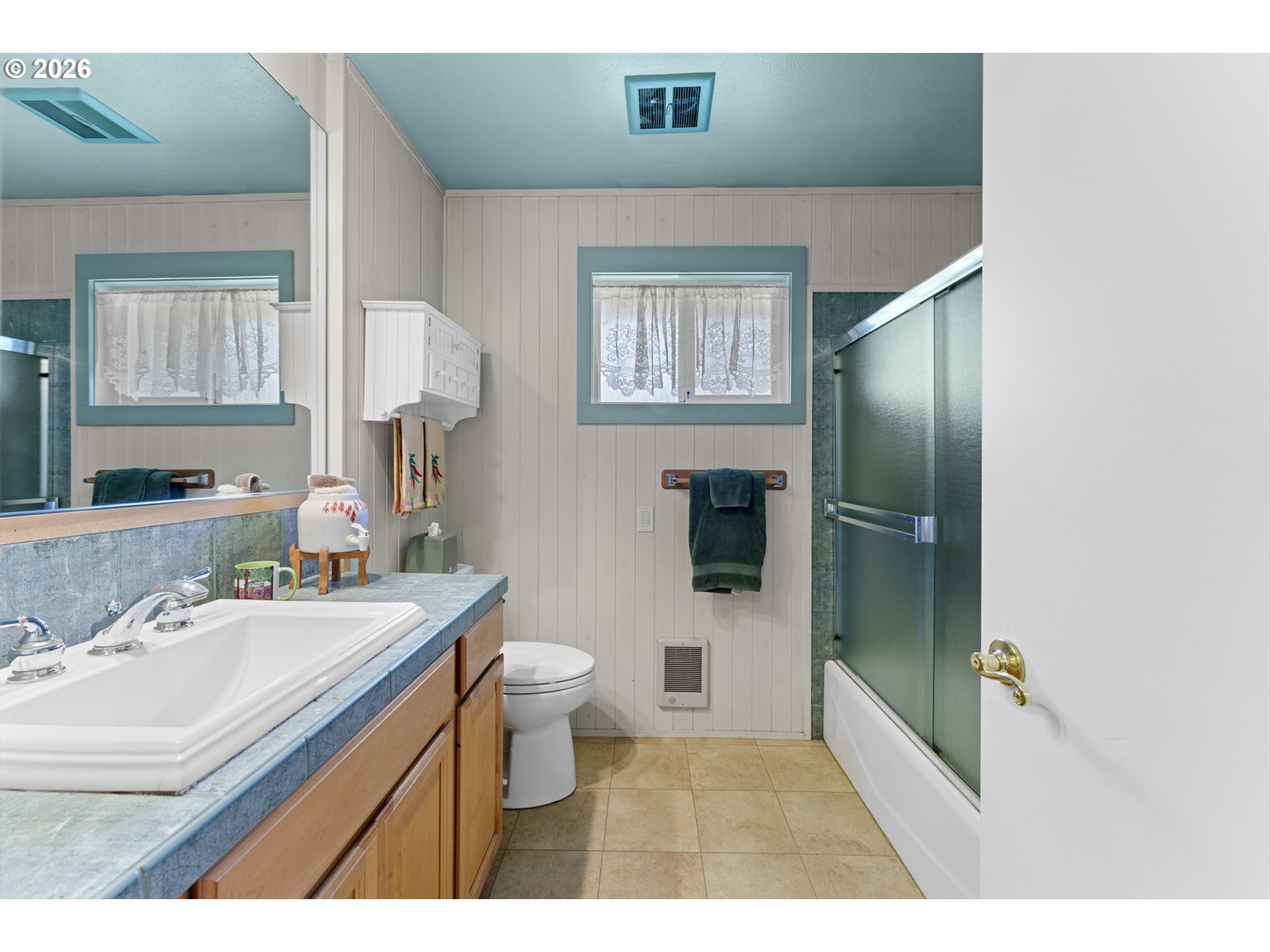 12737 Northeast Cedarbrook Road Aurora, OR 97002 - Photo 15 of 48 a bathroom with a sink toilet a mirror and shower