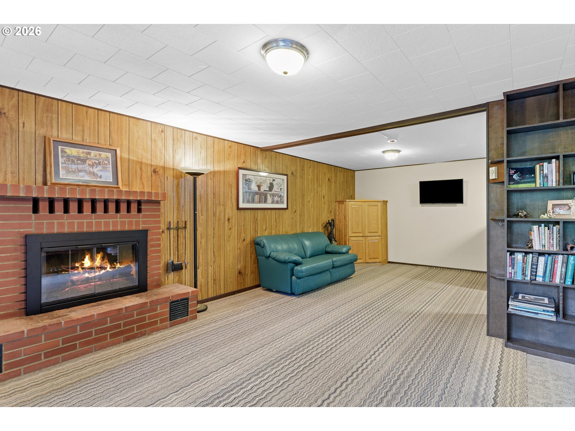 12737 Northeast Cedarbrook Road Aurora, OR 97002 - Photo 22 of 48 a living room with furniture and a fireplace
