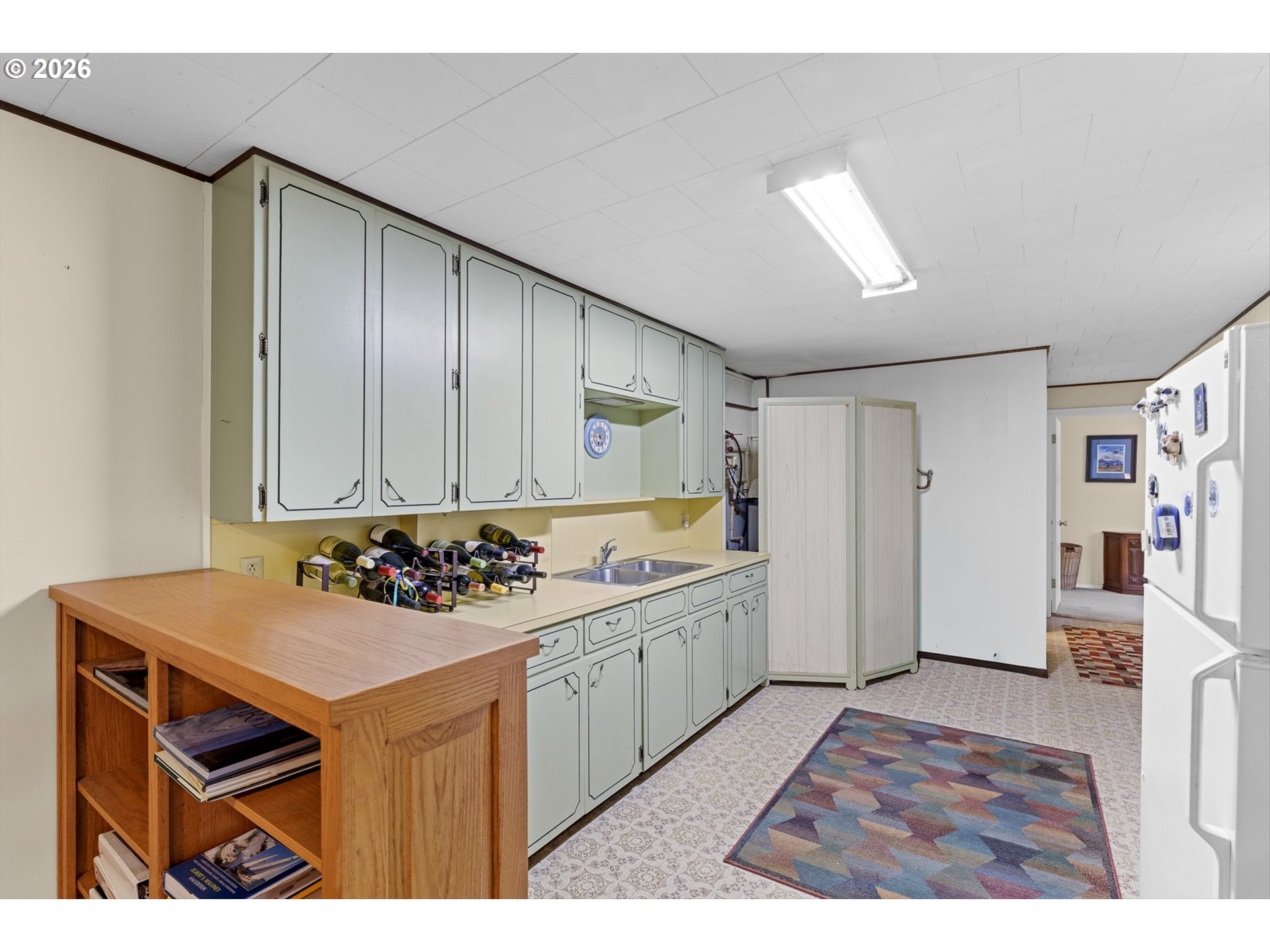 12737 Northeast Cedarbrook Road Aurora, OR 97002 - Photo 24 of 48 a view of a kitchen with a sink and cabinets