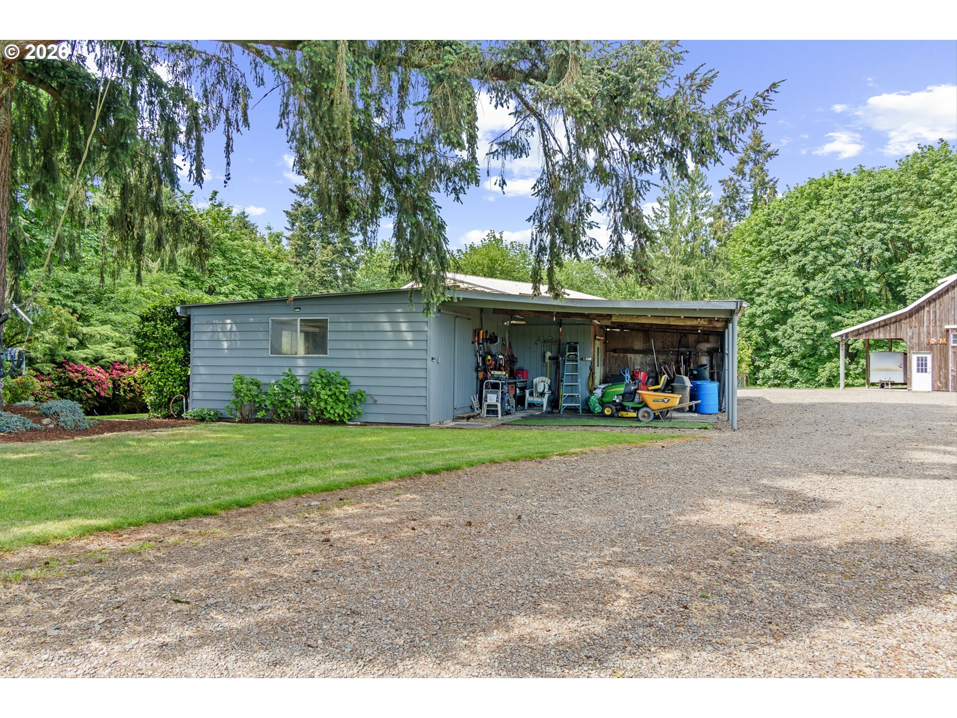 12737 Northeast Cedarbrook Road Aurora, OR 97002 - Photo 31 of 48 a front view of a house with garden