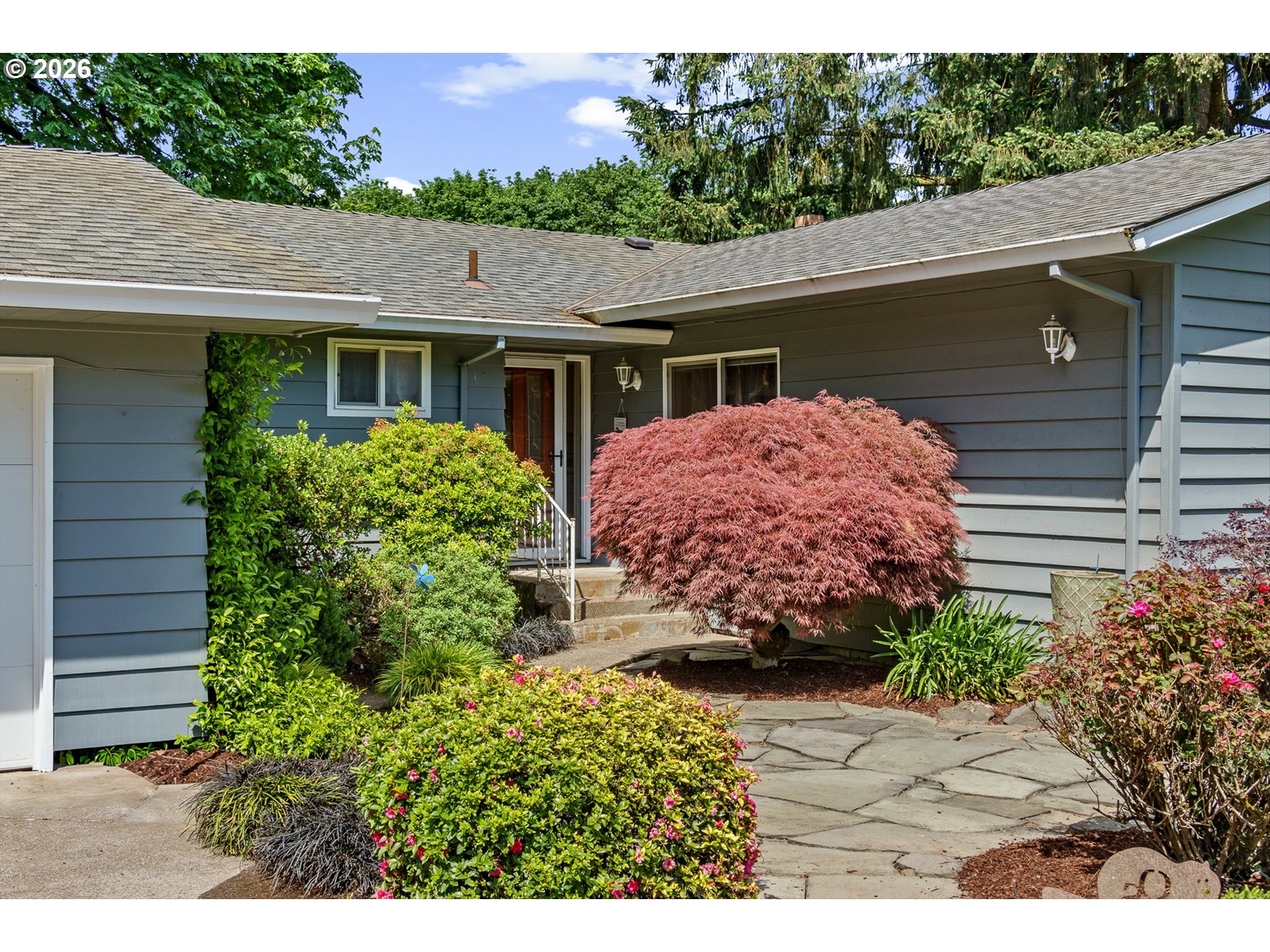 12737 Northeast Cedarbrook Road Aurora, OR 97002 - Photo 4 of 48 a front view of a house with garden